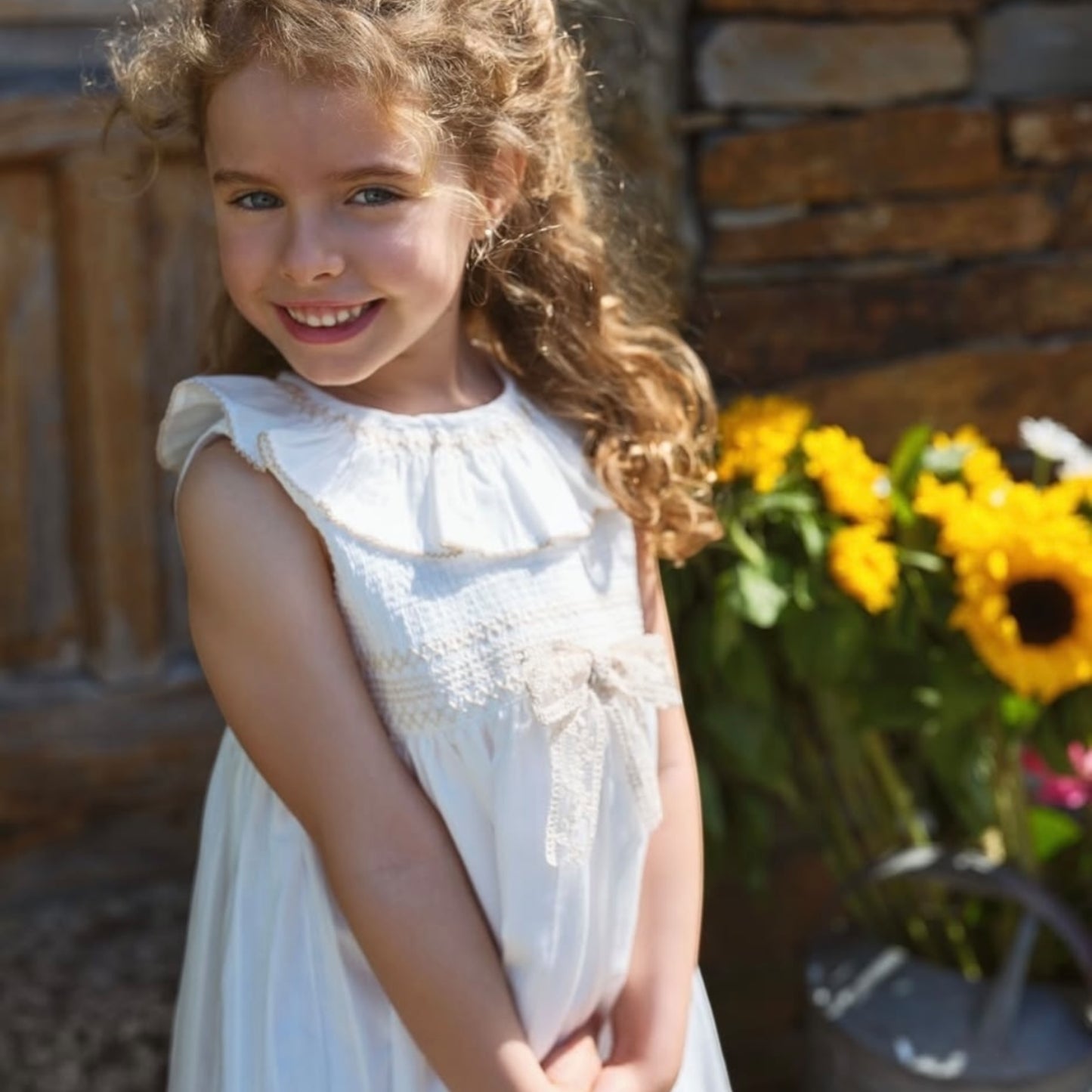 Deolinda - Ivory dress with smocking detail