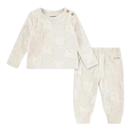 Baby outfit with long-sleeve top and pants on a cream background