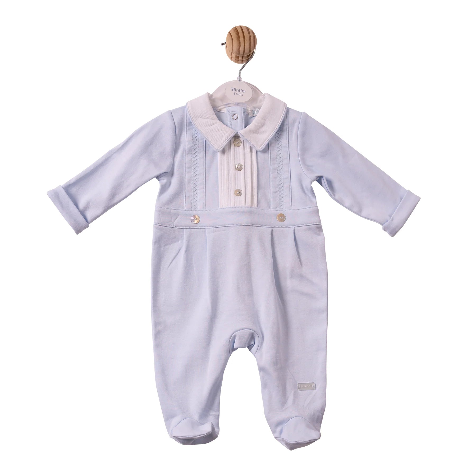 A baby boy's long-sleeve footed romper in light lavender corduroy, featuring a cream-colored faux fur collar and decorative button details on the chest, 