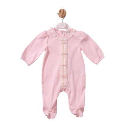 A light pink baby footed sleeper with long sleeves, a lace-trimmed round neckline, and decorative lace down the front